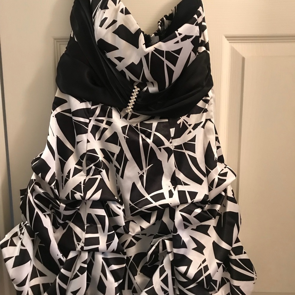 Knee length, very flattering black and white dress